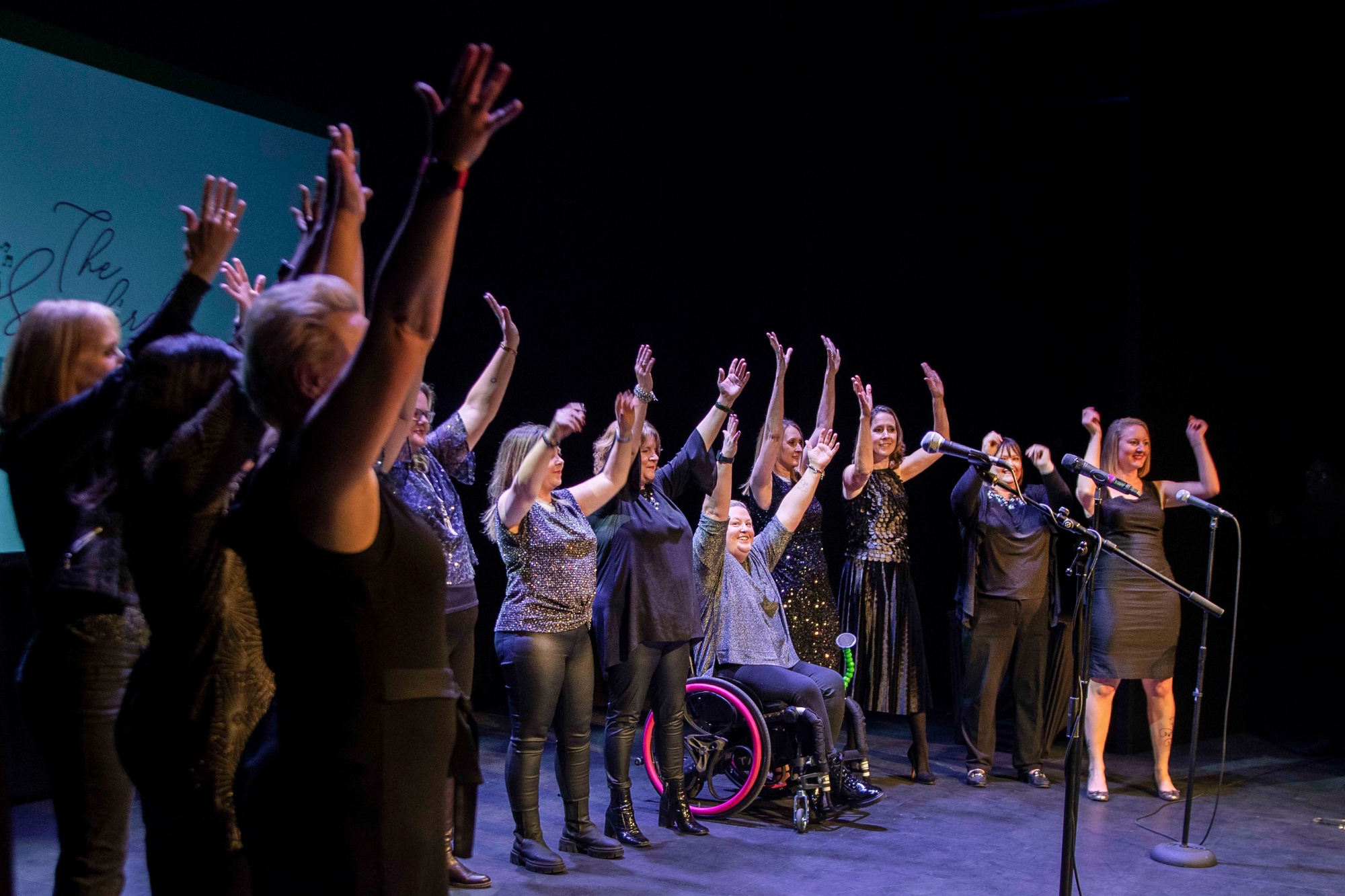 The Songbirds Choir close the event with a performance on stage at the Royal Theatre